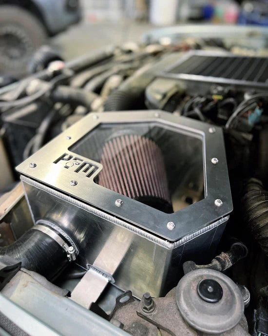 Airbox Installed On Vehicle Featuring The Pro Fabrication And Mechanical Logo